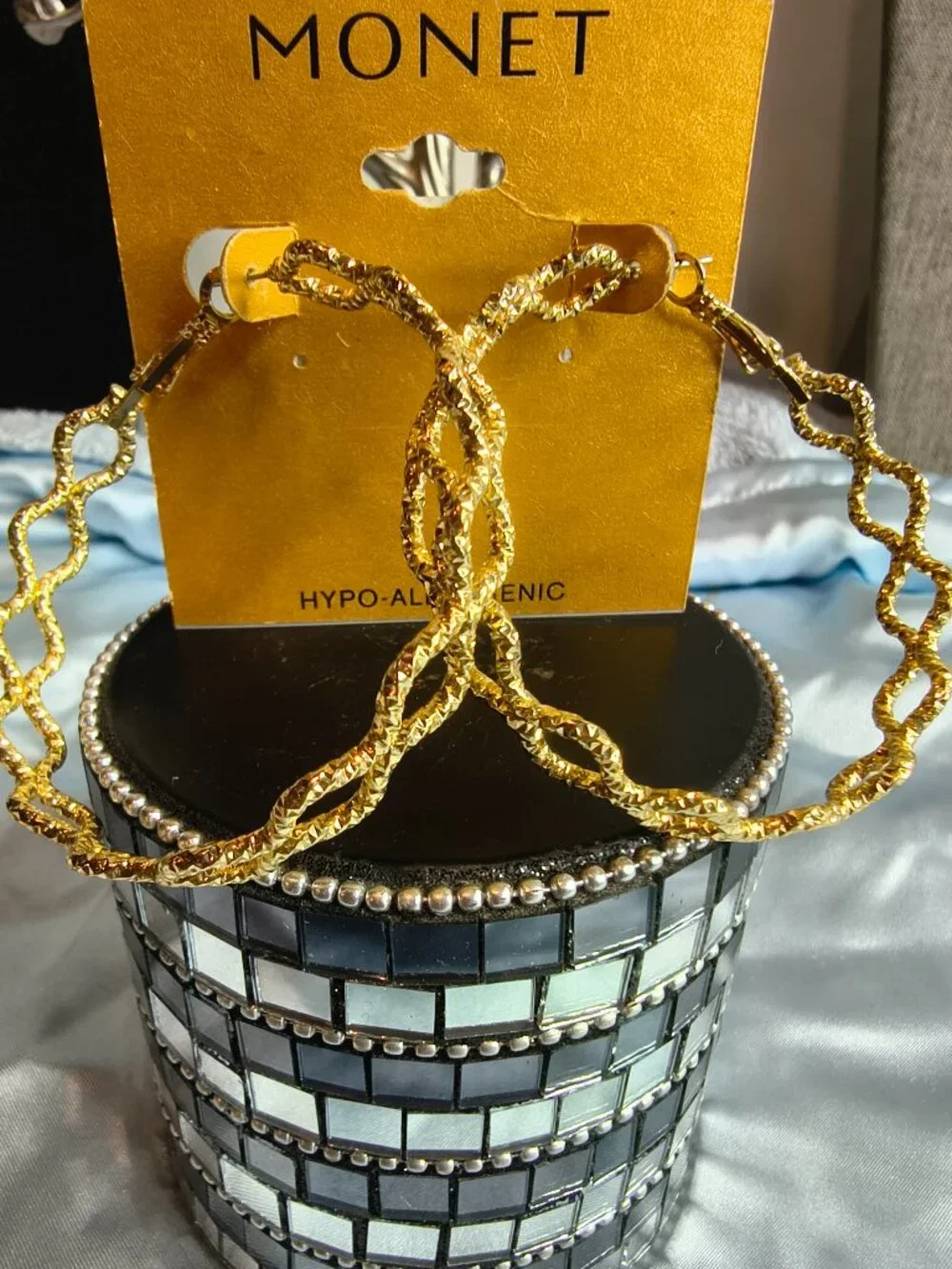 Monet Gold Tone Criss Cross Hoop earrings